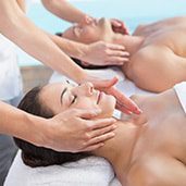 couples-massage at zen'd out massage, denver co Two people getting a couples massage side-by-side.